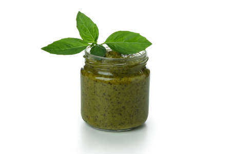 Jar of Pesto sauce isolated on white backgroundの写真素材
