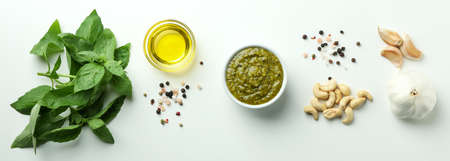 Pesto sauce and ingredients on white backgroundの写真素材