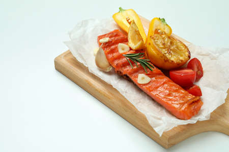 Concept of tasty eating with grilled salmon on white background