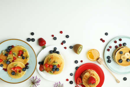 Concept of delicious dessert with pancakes on white backgroundの写真素材