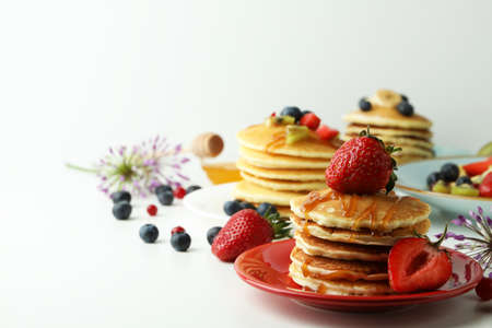 Concept of delicious dessert with pancakes on white tableの写真素材