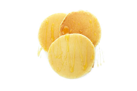 Tasty pancakes with honey isolated on white background