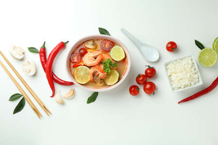 Tom yum soup and ingredients on white background
