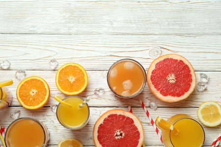 Tequila sunrise cocktail and ingredients on wooden tableの写真素材