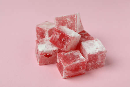Delicious turkish delight cubes on pink backgroundの写真素材