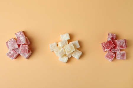 Delicious turkish delight cubes on beige backgroundの写真素材