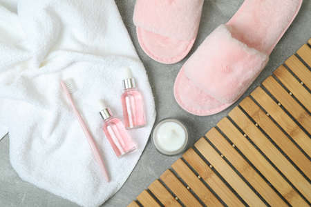 Female sleep routine accessories on gray textured tableの写真素材