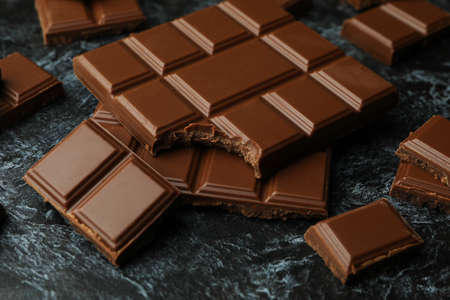 Tasty chocolate bars on black smokey backgroundの写真素材