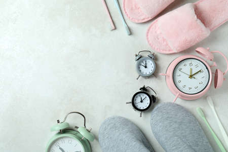 Different sleep routine accessories on white textured tableの写真素材