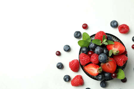 Bowl with berry mix on white backgroundの写真素材