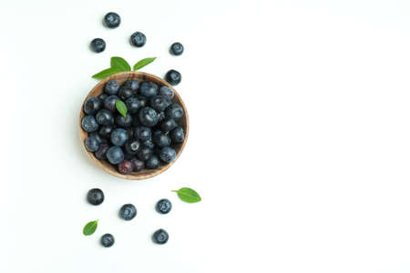 Fresh blueberry with leaves on white background