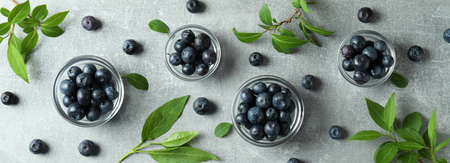 Fresh berry concept with blueberry on gray textured table
