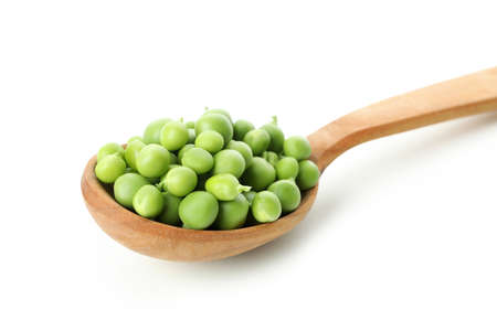 Spoon with pea seeds isolated on white backgroundの写真素材