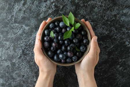 Fresh berry concept with blueberry on black smokey tableの写真素材