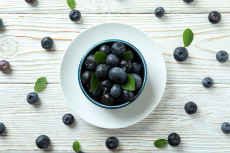 Fresh berry concept with blueberry on white wooden tableの写真素材