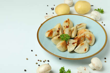 Concept of tasty food with vareniki or pierogi on white backgroundの写真素材