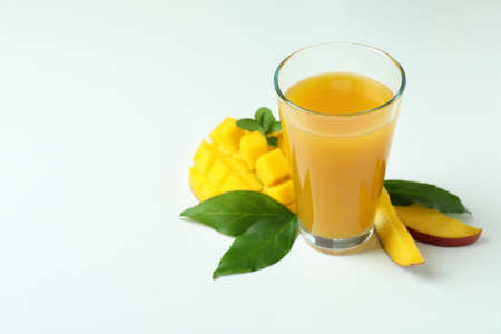 Mango juice and fruit on white backgroundの写真素材