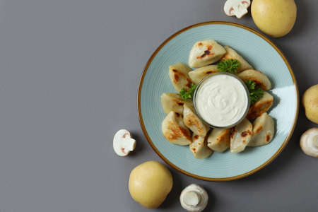 Concept of tasty food with vareniki or pierogi