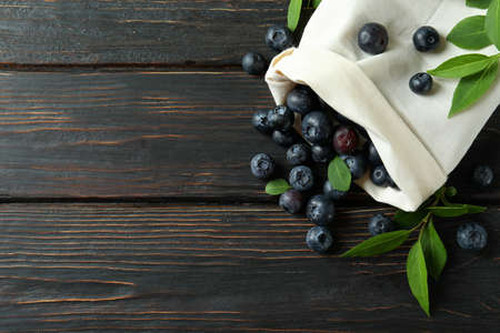 Fresh berry concept with blueberry on wooden tableの写真素材