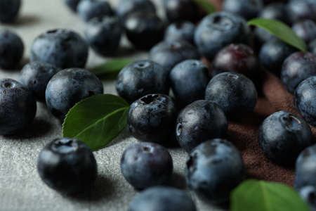 Fresh berry concept with blueberry on gray textured tableの写真素材