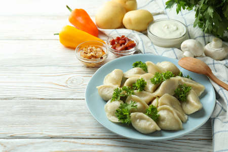 Concept of tasty food with vareniki or pierogi on wooden tableの写真素材