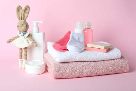 Different baby hygiene accessories on pink backgroundの写真素材