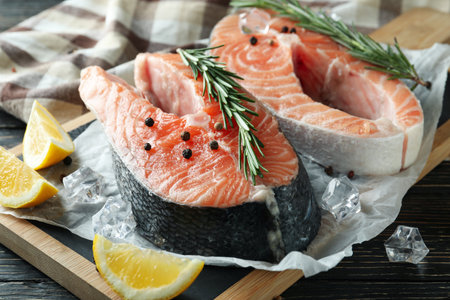 Concept of cooking salmon on wooden tableの写真素材