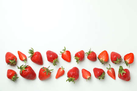 Fresh tasty strawberry with leaves on white background