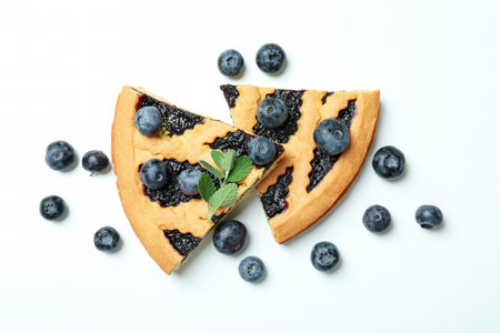 Pieces of blueberry pie with berries on white backgroundの写真素材
