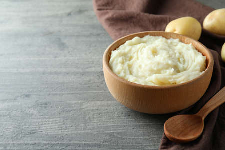 Concept of tasty eating with mashed potatoes on gray textured tableの写真素材