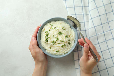 Concept of tasty eating with mashed potatoes on white textured tableの写真素材