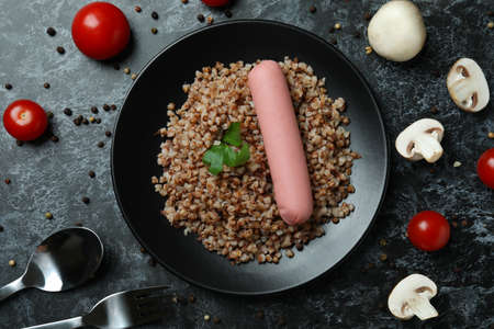 Concept of tasty eating with buckwheat on black smokey tableの写真素材