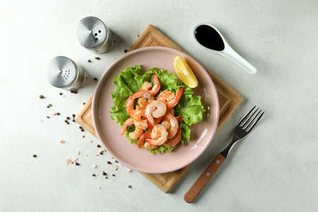 Plate of grilled shrimps on white textured tableの写真素材