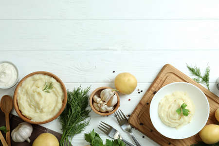 Concept of tasty eating with mashed potatoes on white wooden tableの写真素材