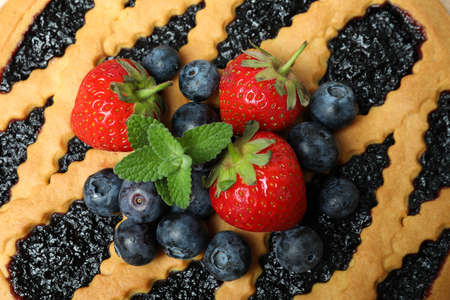 Delicious blueberry pie with blueberry and strawberry, close upの写真素材