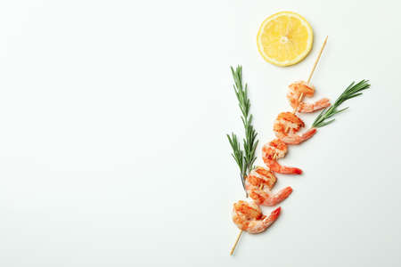 Tasty grilled shrimps skewer on white backgroundの写真素材