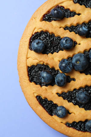 Delicious blueberry pie on violet background, top viewの写真素材