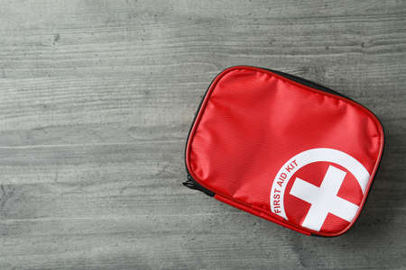 First aid medical kit on gray textured tableの写真素材