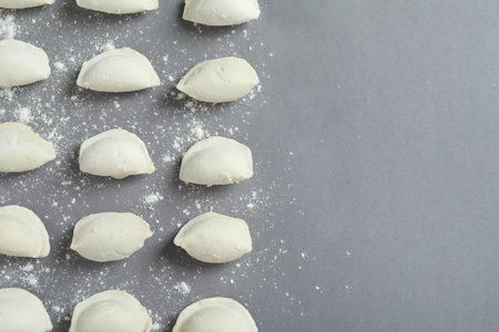 Concept of cooking vareniki or pierogi on gray backgroundの写真素材