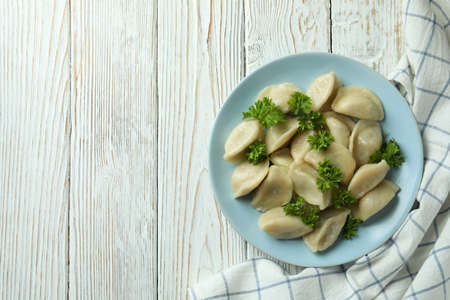 Concept of tasty food with vareniki or pierogi on wooden tableの写真素材