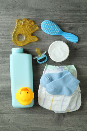 Baby hygiene accessories on gray textured tableの写真素材