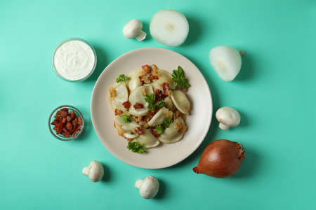 Concept of tasty food with vareniki or pierogi on mint backgroundの写真素材