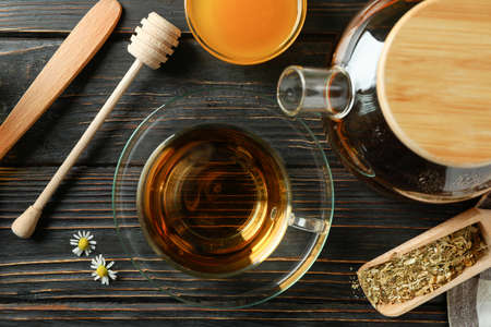 Concept of cooking chamomile tea on rustic wooden tableの写真素材