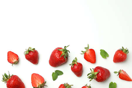 Fresh tasty strawberry with leaves on white backgroundの写真素材