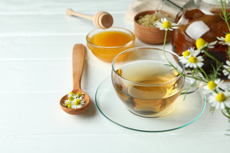 Concept of cooking chamomile tea on white wooden tableの写真素材