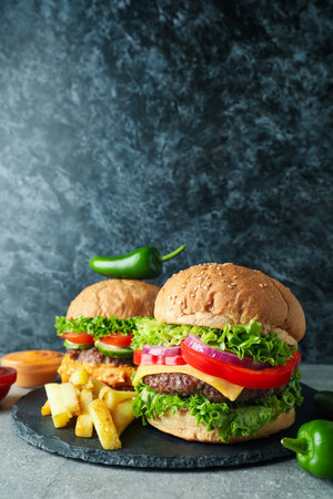 Concept of tasty food with delicious burgersの写真素材
