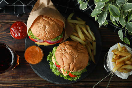 Concept of tasty food with delicious burgers