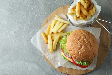 Concept of tasty food with delicious burger