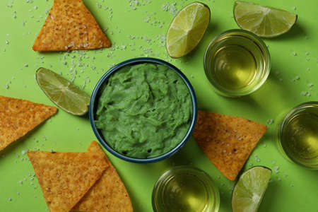 Party concept with tequila, guacamole and chips
