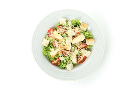 Plate with Caesar salad isolated on white backgroundの写真素材